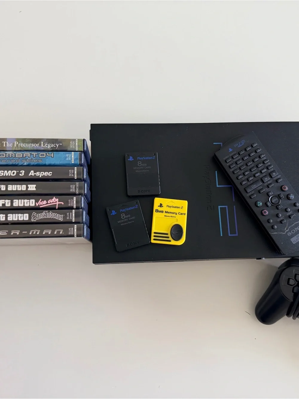 Sony PlayStation 2 Slim Console with Black Controller and Yellow Memory Card